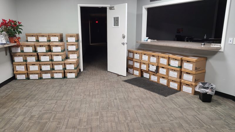 Boxes of documents are ready for pickup in the Thompson Town Hall lobby area